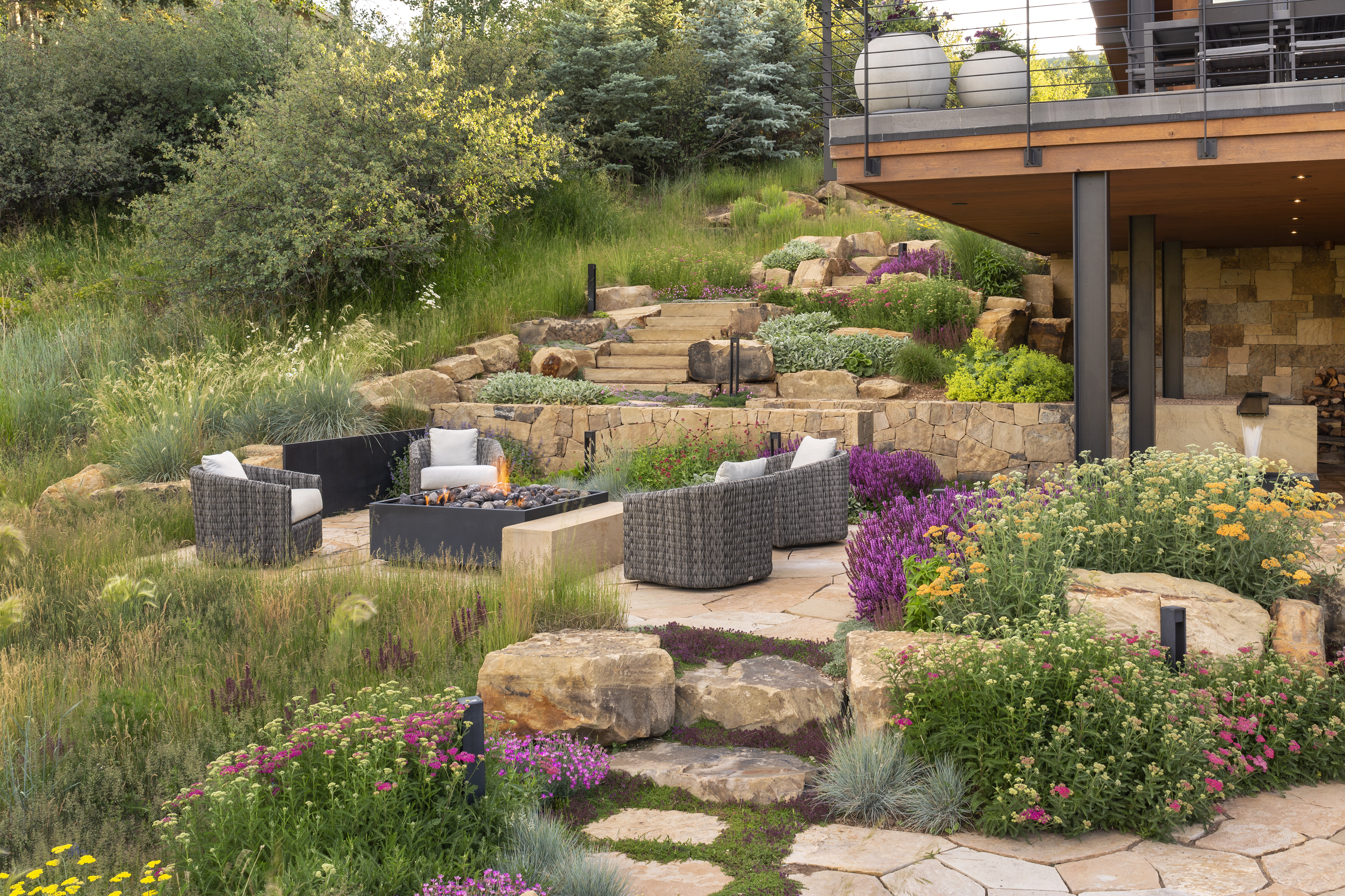Our Process — hero: designed outdoor corridor with stone paving and planting
